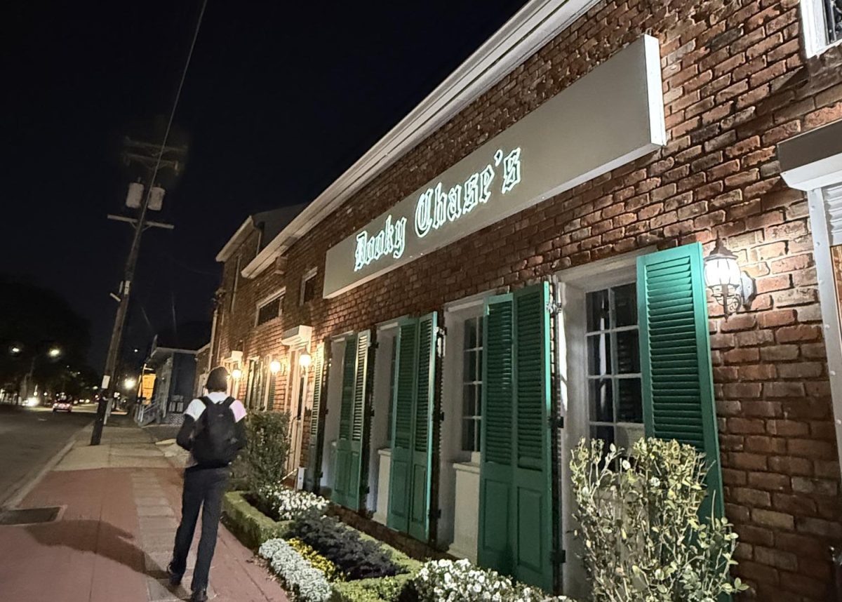 Man walking by Dooky Chase's restaurant at night. The establishement has been open since 1941. 