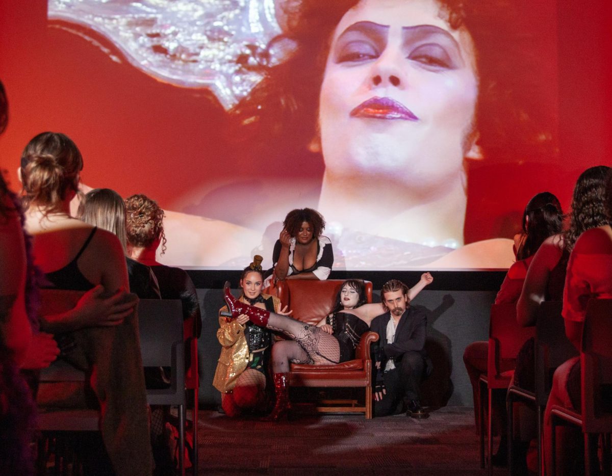 Cast performs Rocky Horror Picture Show with a shadow class with students in the audience.

