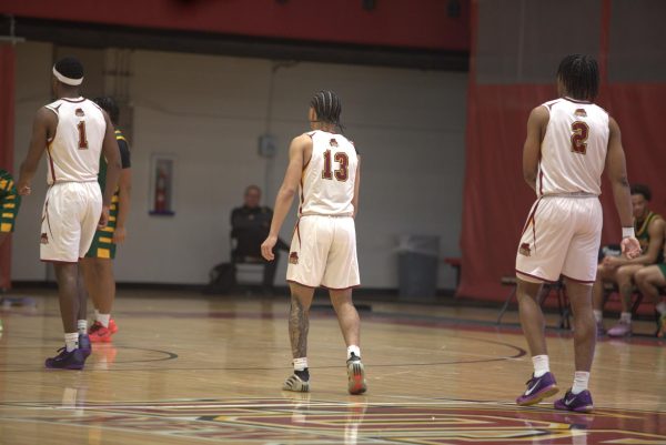 Leonard Jackson, Kameron Johnson, and Zachary Lee playing at The Den. Jackson has recently made 1,000 career point at Loyola. Dessadra Tezeno/ The Maroon