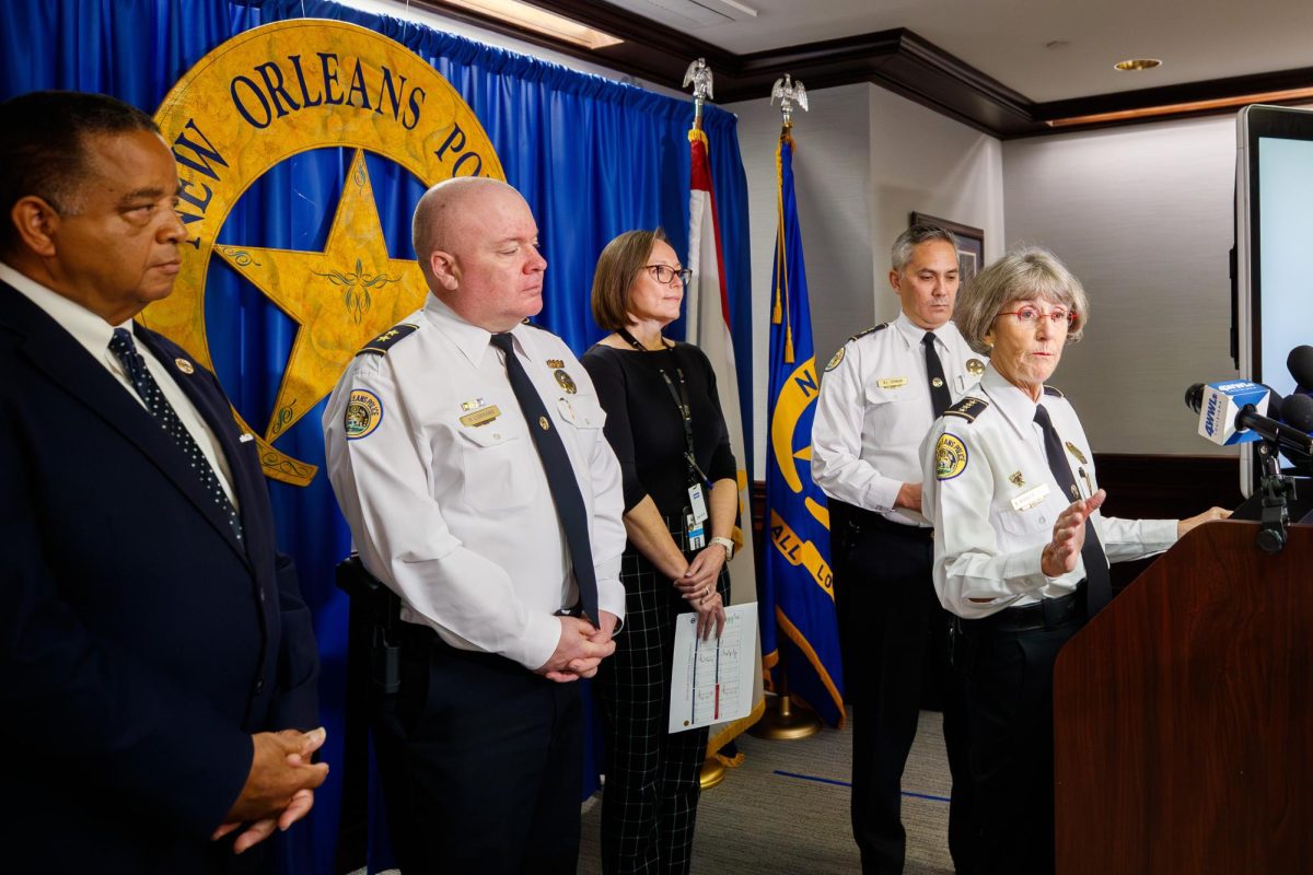New Orleans Police Department superintendent Anne Kirkpatrick, with members of police command staff and New Orleans City Councilmember Eugene Green, far left, speaks about the city's crime statistics during a news conference at police headquarters in New Orleans, Monday, Jan. 5, 2026.