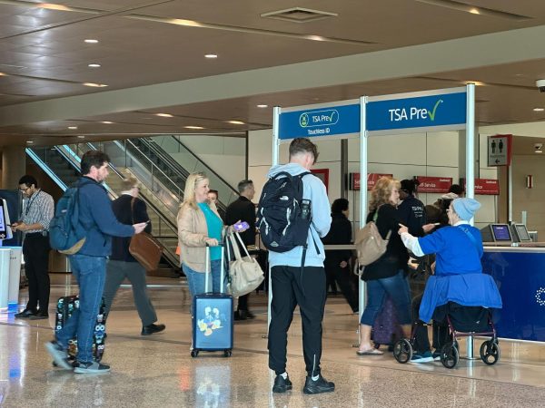 People walk through TSA PreCheck at Dallas Love Field on Sunday, Feb. 22, 2026.
