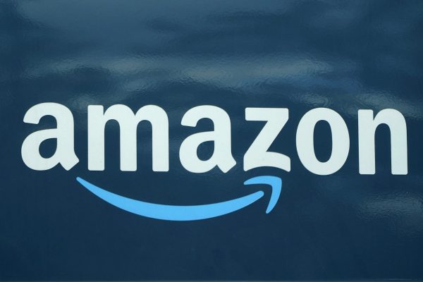 An Amazon logo appears on an Amazon delivery van in Boston, Oct. 1, 2020. Amazon’s cloud computing unit Amazon Web Services plans to invest $11 billion to build a data center in northern Indiana that will create at least 1,000 new jobs. Republican Gov. Eric Holcomb announced the planned project Thursday, April 25, 2024 calling the data center planned near the town of New Carlisle, about 15 miles west of South Bend, “the largest capital investment announcement in Indiana’s history.” (AP Photo/Steven Senne, File)
