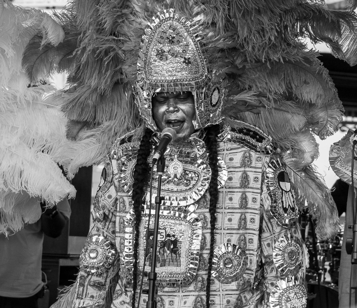 Flagboy Giz prefomes set at French Quarter fest dressed in his hand beaded suit as part of the Mardi Gras Indian tradition. Flagboy Giz recently blew up on social media for his song "We Outside" gaining populatiry outside of the New Orlenas regoin. Sophia Renzi/ The Maroon