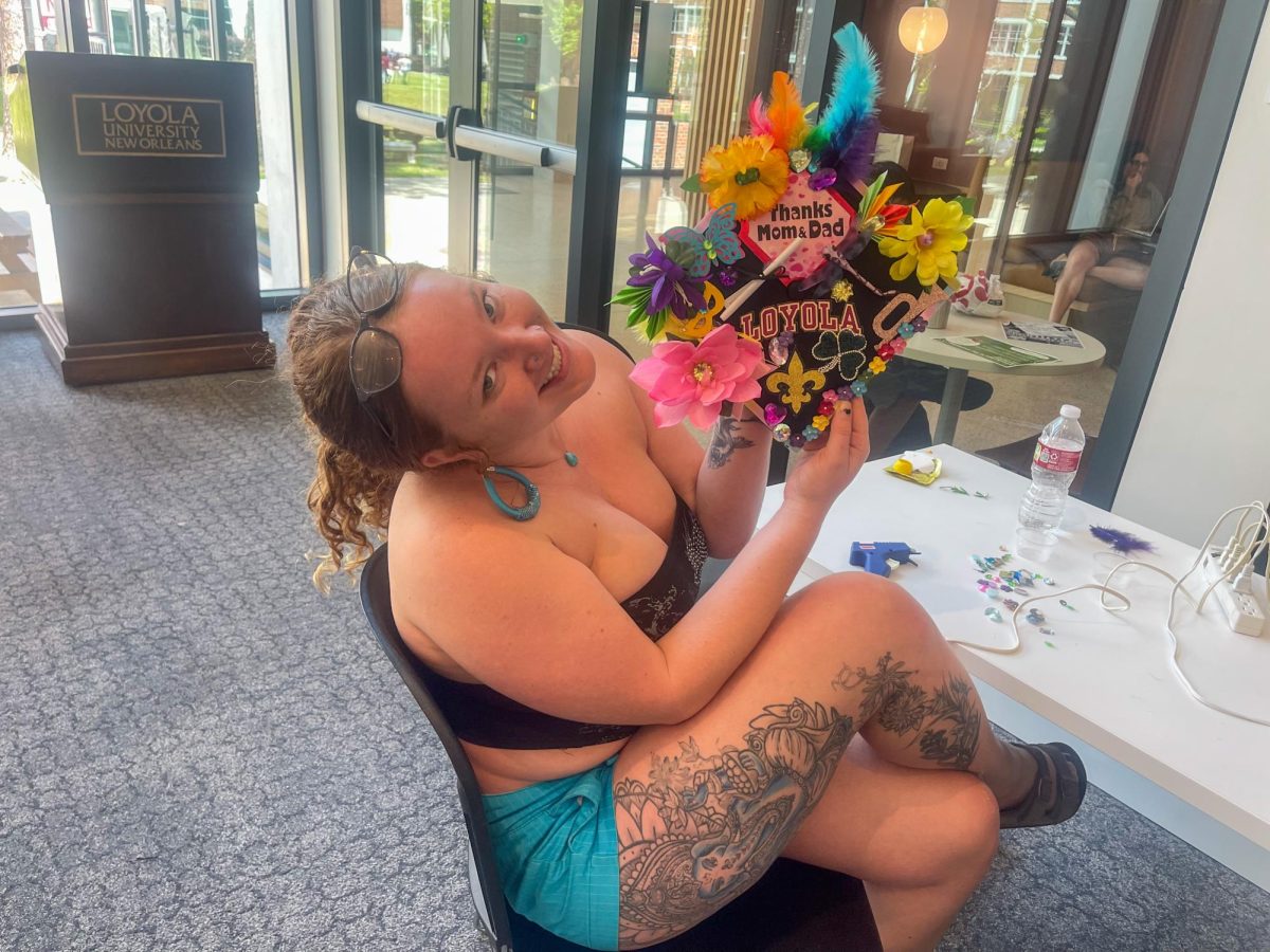 Student shows off their cap that thanks their mom and dad. Student
Life and Ministry hosted an event where seniors could decorate their
caps during Senior Sendoff Week.