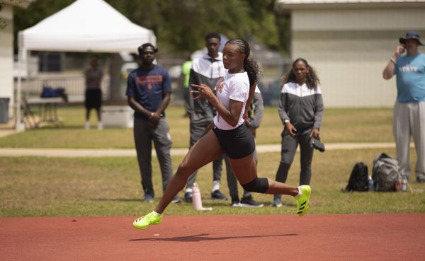 Tenosh Landry running to for takeoff. She is a repeat champion in high jump. Courtesy Camal Petro.